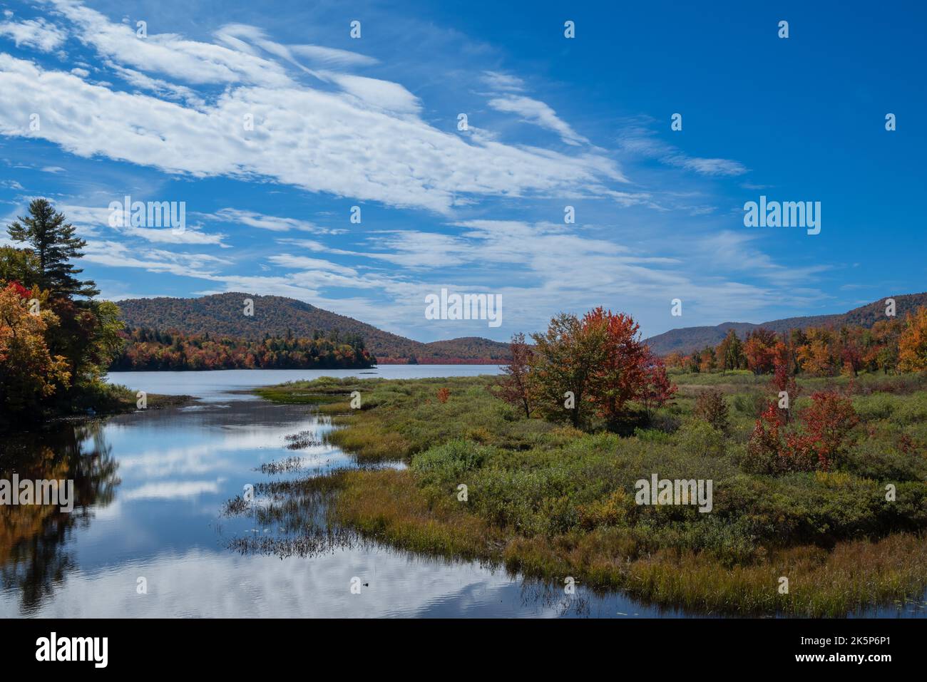 `A view of Lewey Lake in the Adirondack Mountains, NY USA in autumn with fall colors on display Stock Photo